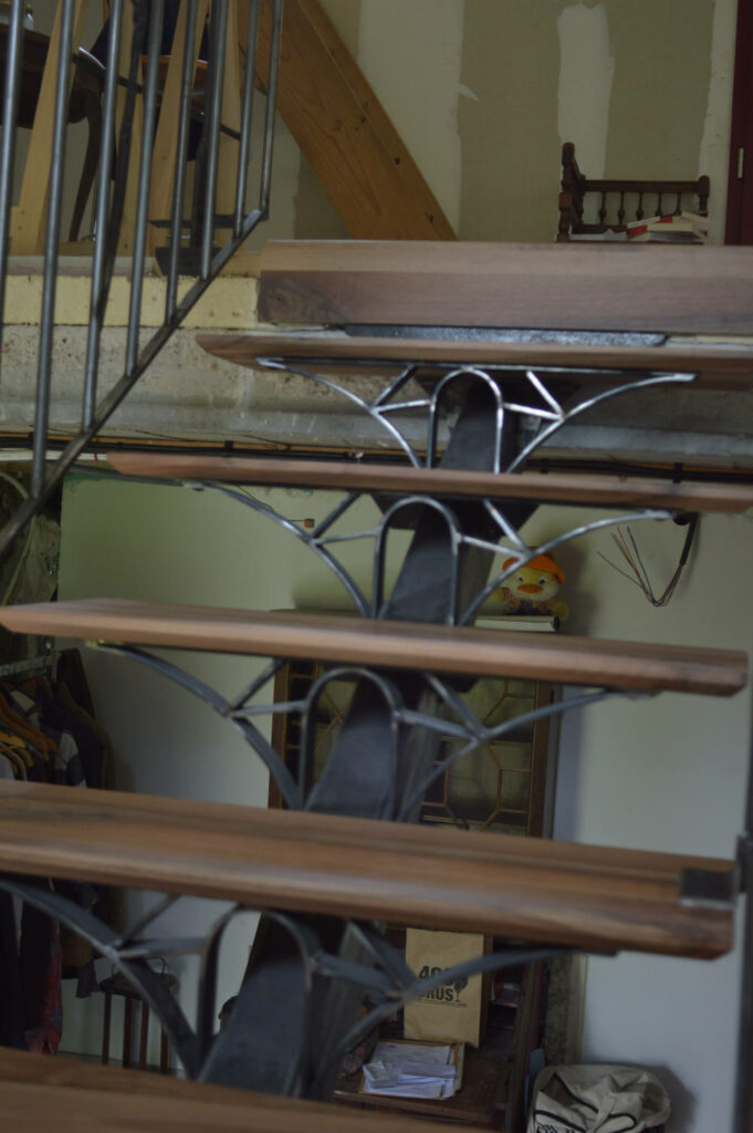 walnut wooden steps and iron brackets